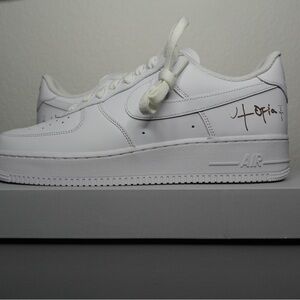 Nike Air Force 1 White Sneakers with Signature Detail